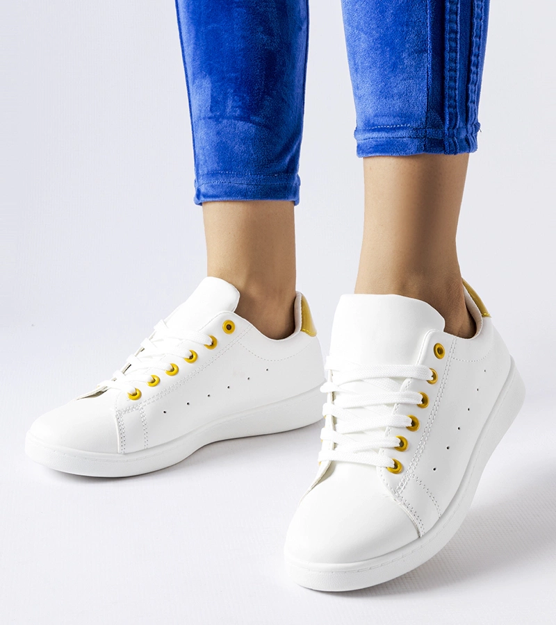 Białe tenisówki z żółtymi akcentami Bushnell